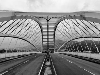 Bridge against sky in city