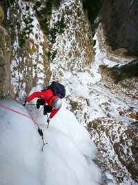 High angle view of man skiing on rock