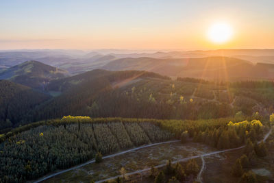 Scenic view of landscape against sky during sunset