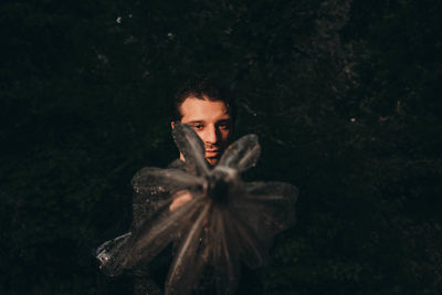Portrait of a young man standing on land