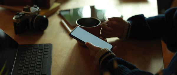 High angle view of coffee cup on table