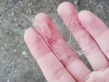Close-up of hand holding ice cream