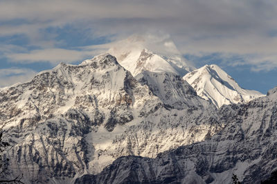 Scenic view of snowcapped mountains against sky