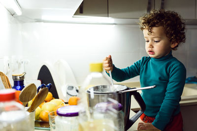 Full length of man having food at home