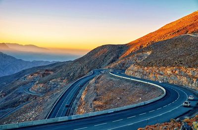 Country road leading towards mountains