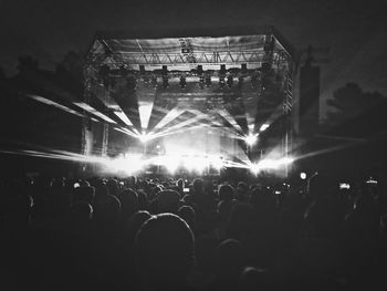 Rear view of people enjoying at concert