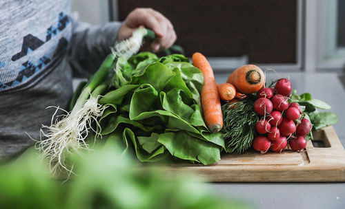 Young boy with colorful produce