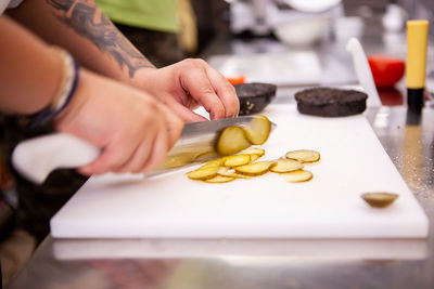 Midsection of man preparing food