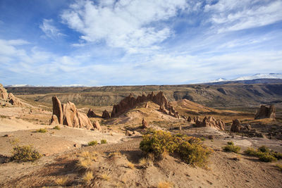 Scenic view of landscape against cloudy sky