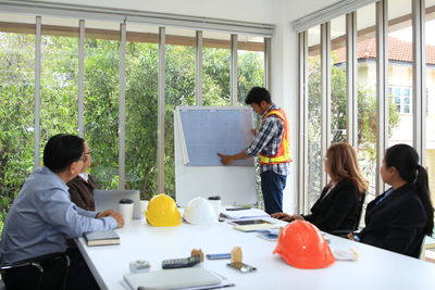 People standing by window