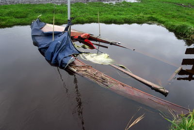 Abandoned boat in lake