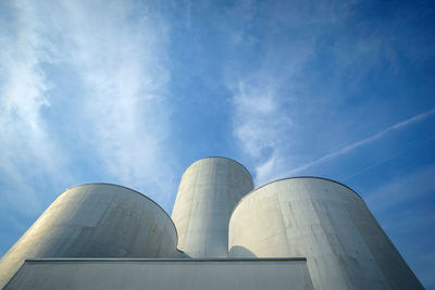 Low angle view of smoke stack against sky