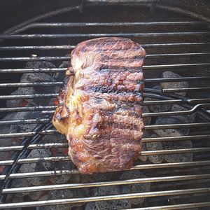 Close-up of meat on barbecue grill