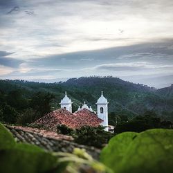 Built structure on mountain against sky