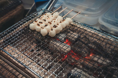 High angle view of meat on barbecue grill