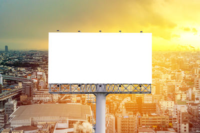 Buildings against sky during sunset