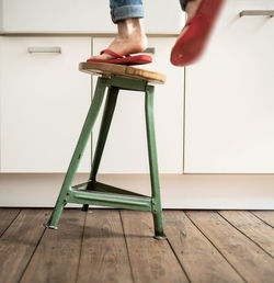 Low section of woman standing on floor