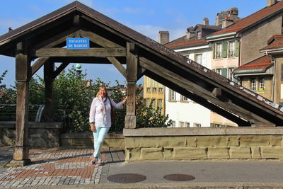 People standing on bridge against sky