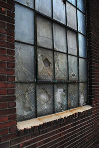 Close-up of window on brick wall