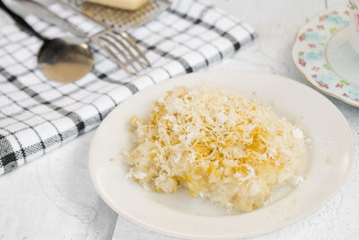 High angle view of rice in bowl on table
