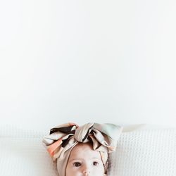 Close-up of girl wearing hat