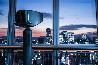 View of illuminated cityscape at dusk