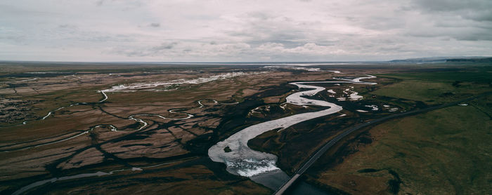 Aerial view of landscape and sea against sky