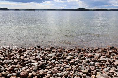 Scenic view of sea against cloudy sky