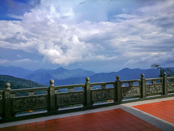 Scenic view of sea and mountains against sky