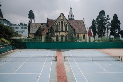 View of swimming pool against buildings