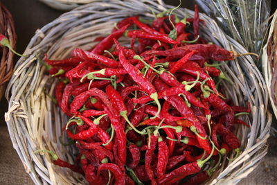 High angle view of red chili peppers in basket