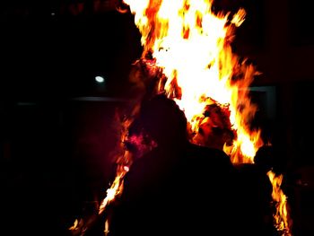 Rear view of bonfire at night