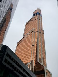 Low angle view of modern building against sky in city