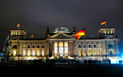 Reichstag building against sky at night