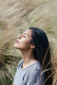 Close-up of young woman looking away