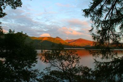 Scenic view of lake with mountains in background