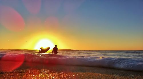 Scenic view of sea at sunset