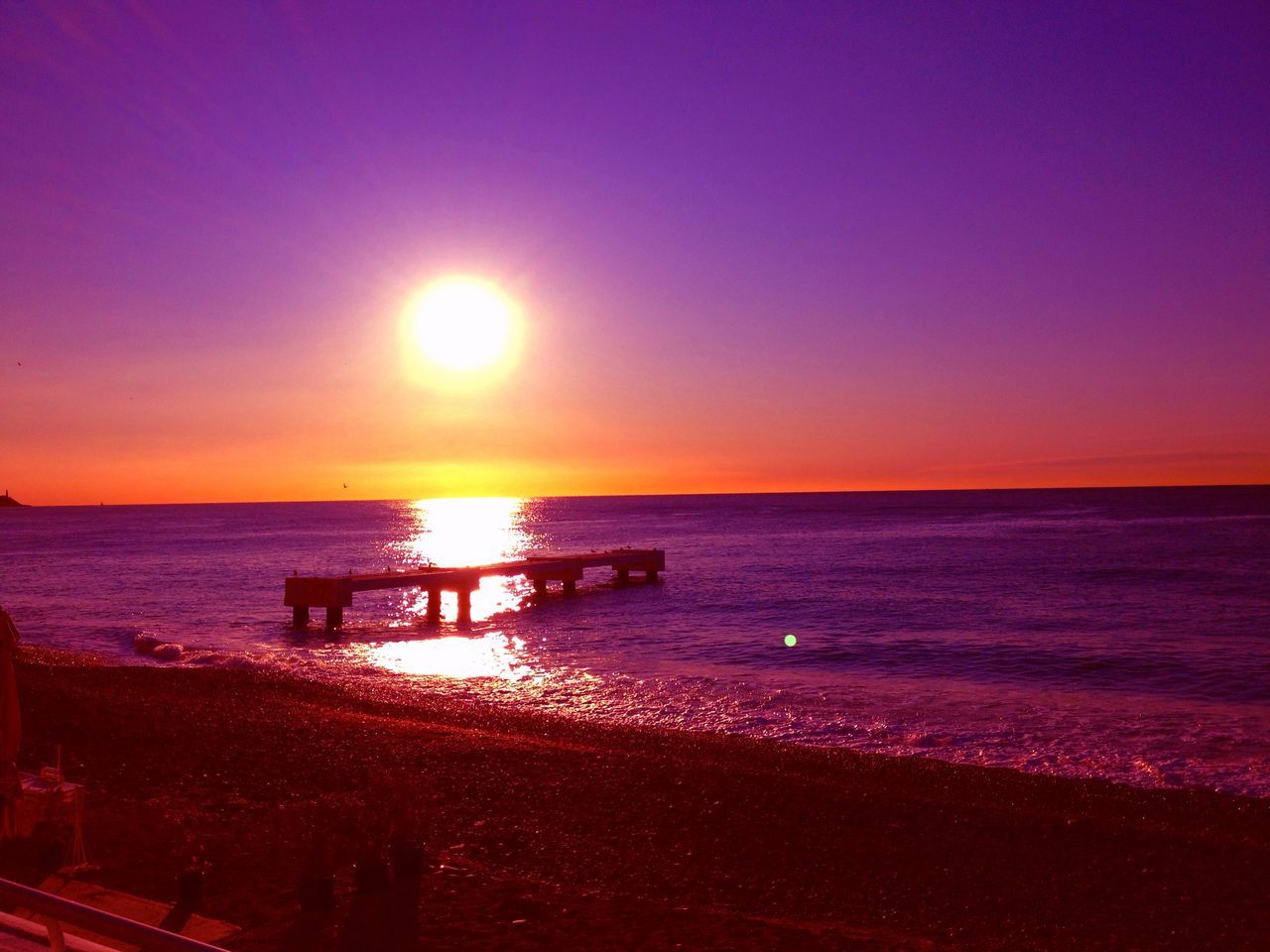 sea, horizon over water, sunset, water, sun, tranquil scene, scenics, tranquility, beauty in nature, beach, reflection, orange color, idyllic, nature, sky, silhouette, shore, clear sky, sunlight, copy space