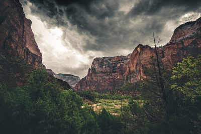 Scenic view of mountains against cloudy sky