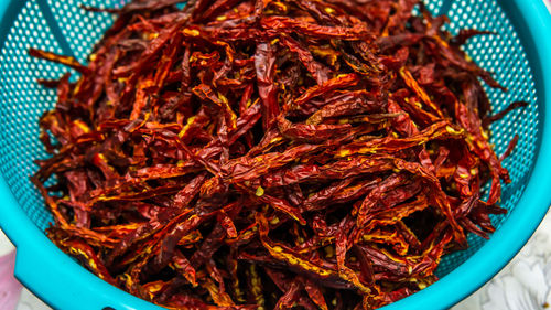 High angle view of red chili peppers in bowl