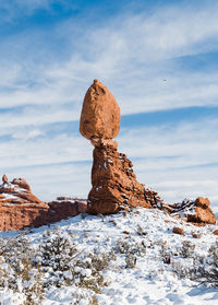 Rock formations against sky during winter