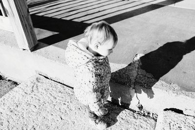 High angle view of girl with shadow on floor