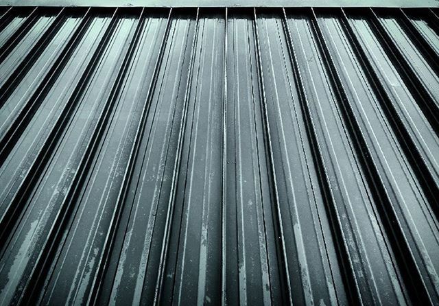 full frame, backgrounds, transfer print, pattern, auto post production filter, repetition, textured, close-up, low angle view, no people, in a row, abstract, detail, outdoors, day, design, metal, striped, wood - material