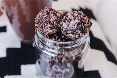 High angle view of chocolate balls in glass jar