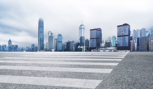 Modern buildings in city against sky