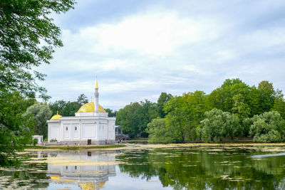 View of the pond and the building of the turkish bath in catherine park. local tourism. 