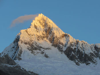 Snowcapped mountains against clear sky