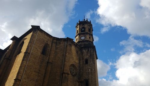 Low angle view of bell tower against sky