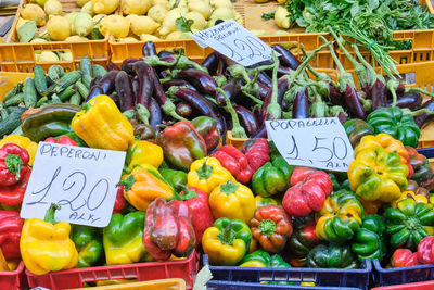 Bell peppers and eggplants for sale at a market