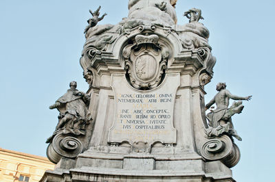 Low angle view of statue against sky